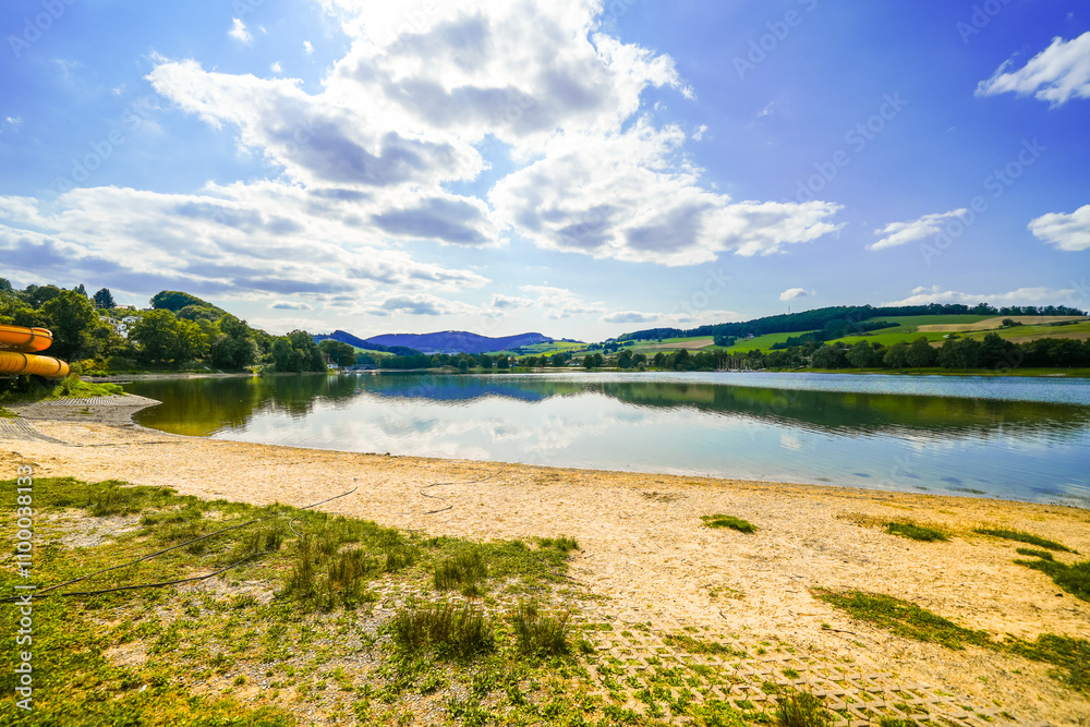 Fototapeta premium View of Lake Diemelsee and the surrounding landscape. Idyllic nature at the reservoir in Sauerland. 