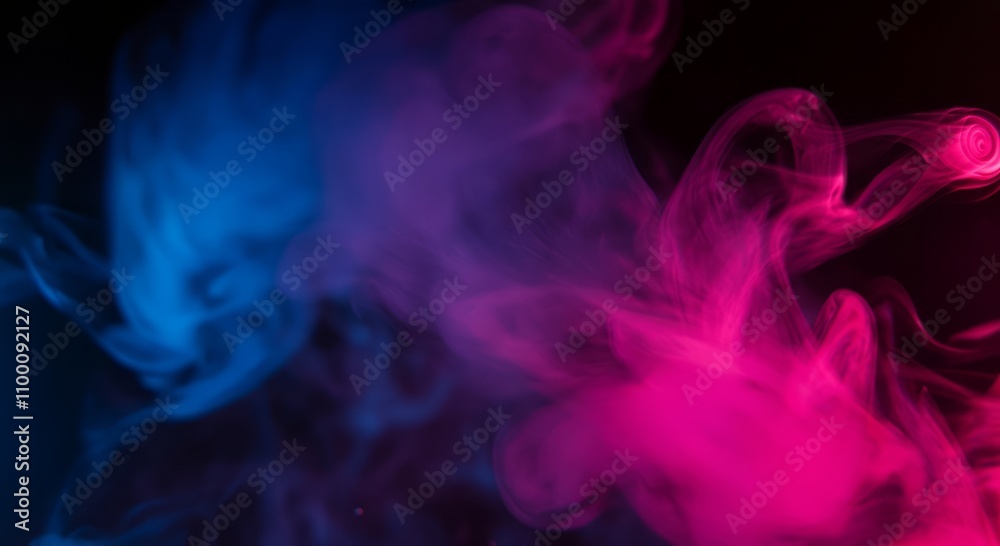Fototapeta premium Vibrant plumes of blue and pink smoke swirling in dark abstract background
