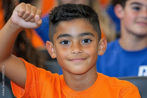 A classroom scene where a student raises their hand, fully engaged in a lively discussion with the teacher photo