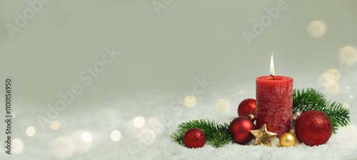 Christmas Background - Red Candle in winter snow landscape background - Blank greeting card with magic golden bokeh lights with copy space for your Xmas Advent greeting card or advertisement, Panorama
