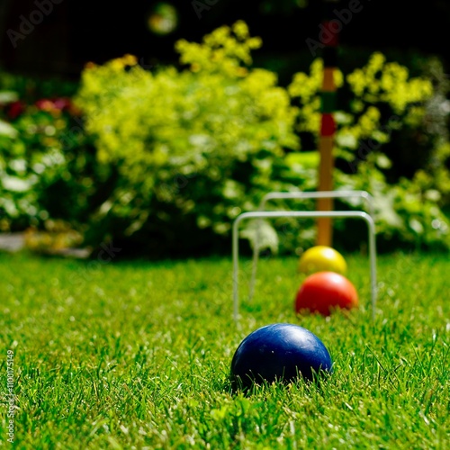 croquet balls on the grass photo