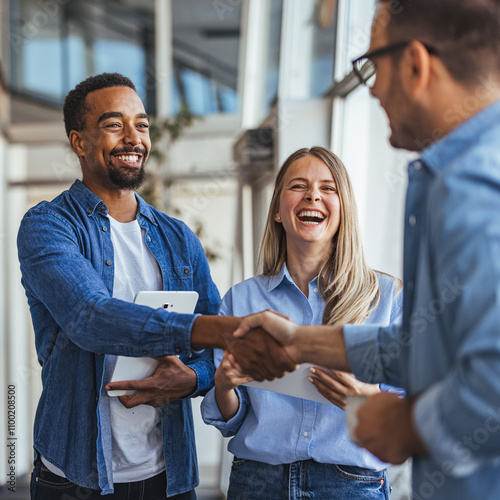 Diverse Team in Office Handshake and Collaboration