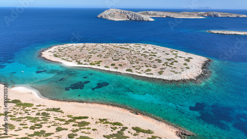 Aerial drone photo of paradise emerald bay of Koutsomitis islet resembling a blue lagoon a favourite place for yachts and sailboats, Astypalaia island, Dodecanese, Greece photo