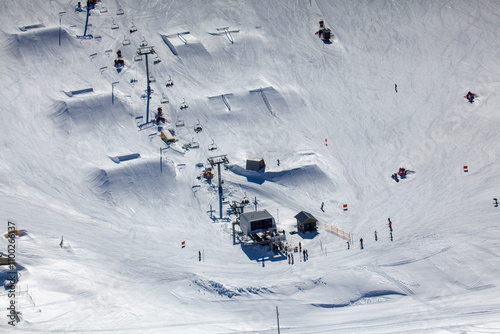 Aerial view of Mount Hotham ski resort with people skiing on snowy slopes, Victoria, Australia. photo