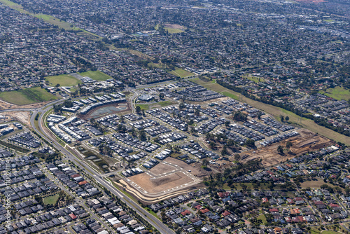 Aerial view of suburban development with modern homes and infrastructure, Cranbourne South, Australia. photo