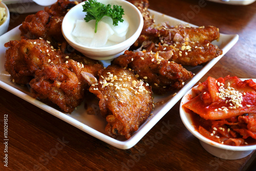 Chilly Korean chicken, sesame, kimchi, Korean food, Spicy Deep Fried Breaded Chicken Wings with Ranch, Korean fried chicken. photo