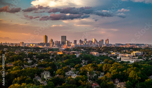 Aerial view of boston skyline at sunset with beautiful clouds and greenery, jamaica plain, united states. photo