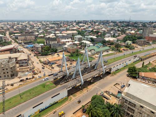 Aerial view of amawbia bridge spanning over bustling traffic and urban landscape, awka south, nigeria. photo