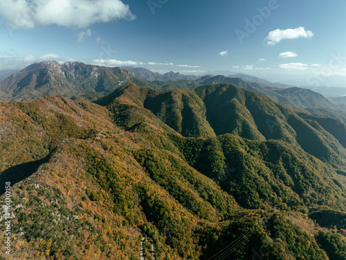 Aerial view of the majestic Mount Picentini with a serene valley and picturesque clouds, Giffoni Valle Piana, Italy. photo