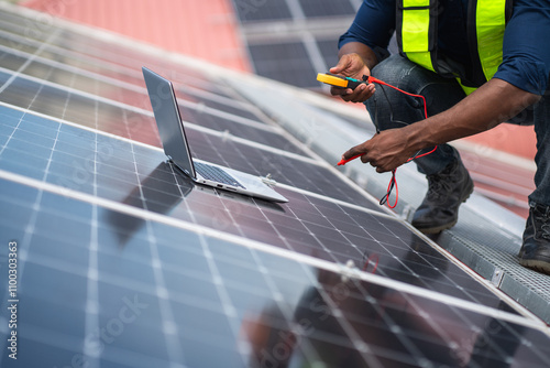 Service engineer checking solar cell on the roof for maintenance if there is a damaged part. Engineer worker install solar panel. Clean energy concept.