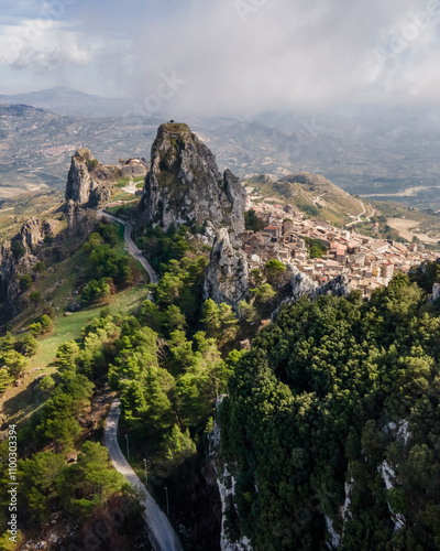 Aerial view of the beautiful village nestled in the mountains with rock formations and a panoramic valley, Caltabellotta, Sicily, Italy. photo