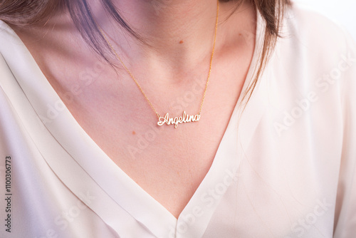 Name necklace on young woman