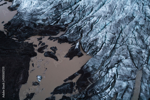 Aerial view of a majestic glacier with rugged ice formations and barren terrain, Oraefasveit, Iceland. photo