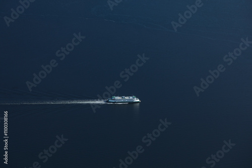 Aerial view of a beautiful Washington State Ferry sailing across the calm waters of Puget Sound, Seattle, United States.