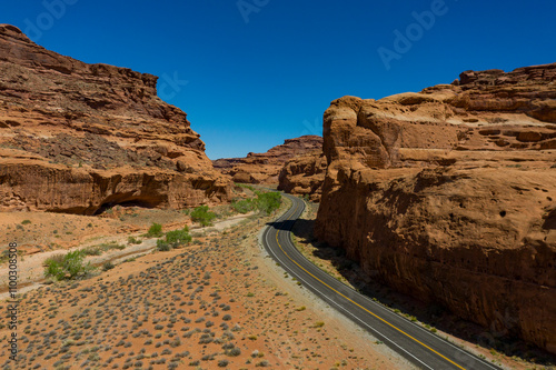 Aerial view of a scenic canyon with a blacktop road and rugged rocks, Garfield County, United States. photo