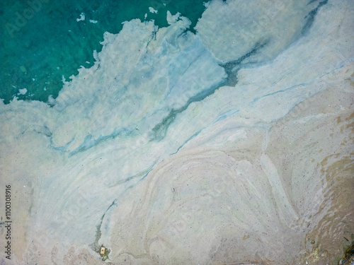 Aerial view of beach with algae accumulation and turquoise water, Pula, Croatia. photo