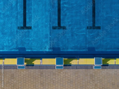 Aerial view of public swimming pools with blue water and diving boards, Gropiusstadt, Berlin, Germany. photo