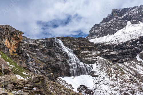 Snow cladded mountain view enroute Rupin pass trekking trail. It is a high altitude trek in Himachal Pradesh located at 4650m with Himalayan ranges, glacial meadows and snow-covered landscapes.