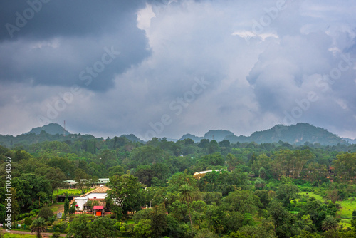 Panoramic view of Pachmarhi valley having clouds and mist shrouded hills rolling on each other from Pandava Caves top point in Pachmarchi, Madhya Pradesh, India. photo