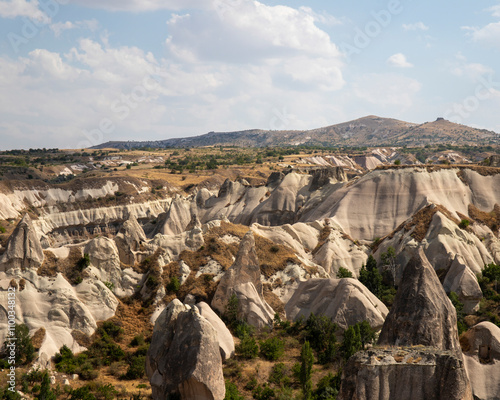 View of scenic rock formations and valley with fairy chimneys, Goreme, Turkey. photo