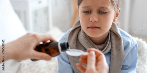 Ill little girl taking coug...