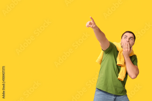 Shocked young man pointing ...