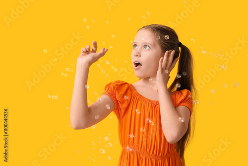 Cute girl with soap bubbles...