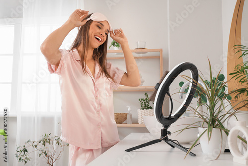 Young woman recording video...