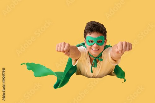 Teenage boy dressed as supe...