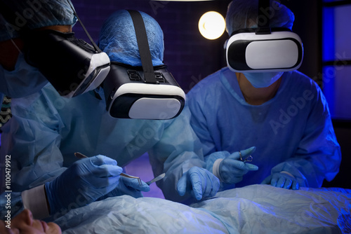 Doctors with VR glasses ope...