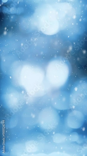 Vertical Blue Lights with Christmas Snow 4K Loop features a blue atmosphere with defocused lights and snow and particles falling in a vertical ratio loop.
