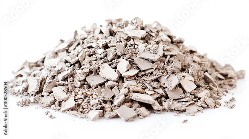Construction waste in the form of a pile of concrete fragments on white background