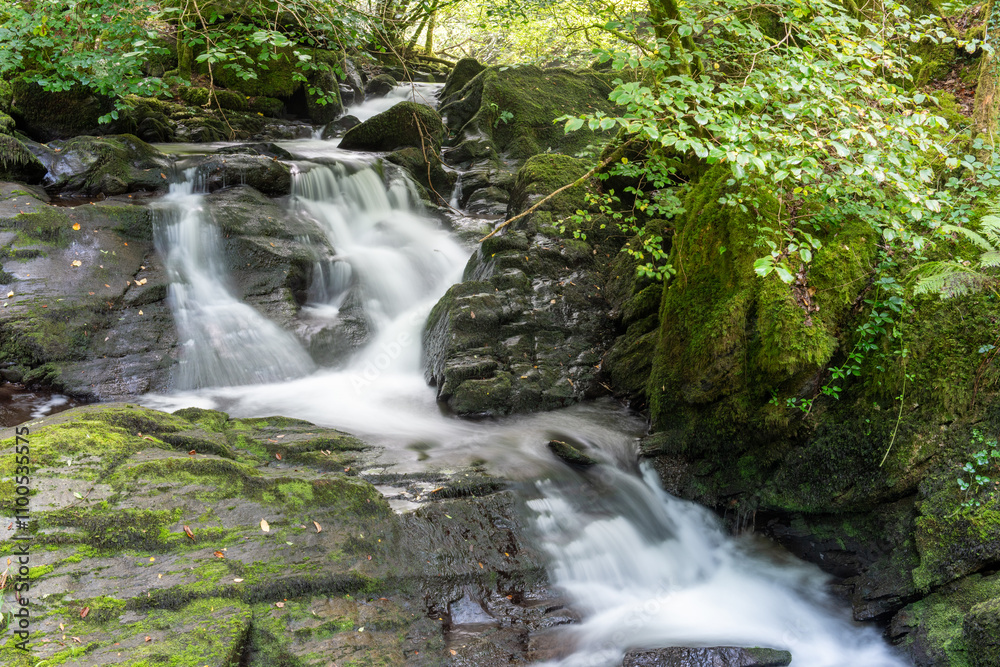 Fototapeta premium Long exposure of a waterfall at Watersmeet in Exmoor National Park