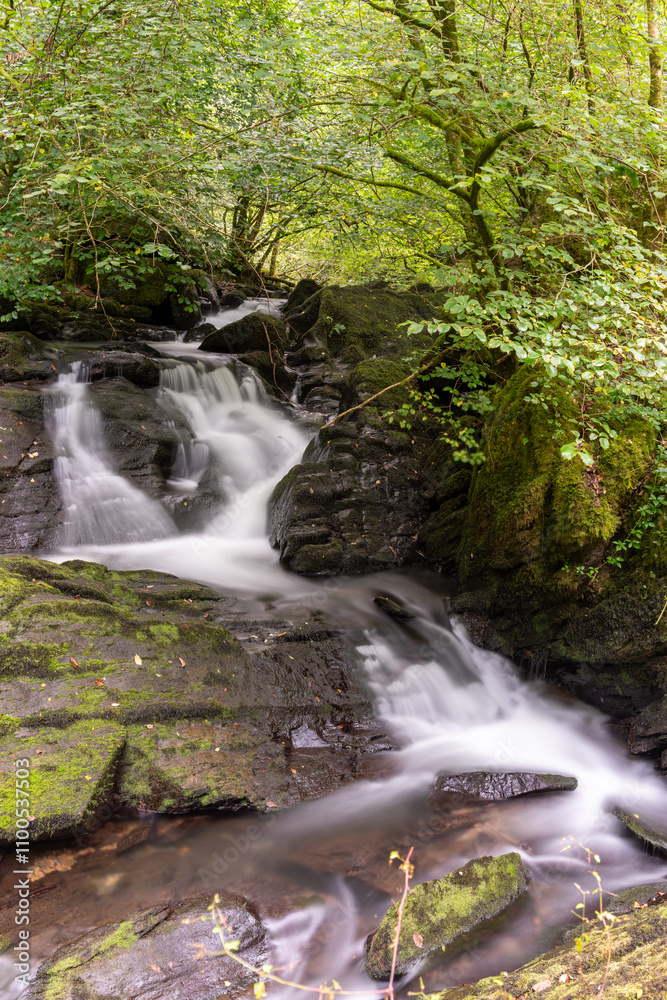 Long exposure of a waterfall at Watersmeet in Exmoor National Park Long exposure of a waterfall at Watersmeet in Exmoor National Park