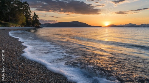 Serene Sunset Over Tranquil Waters, a breathtaking view of a vibrant sunset casting warm hues over a peaceful sea, gentle waves softly caressing the sandy shore photo