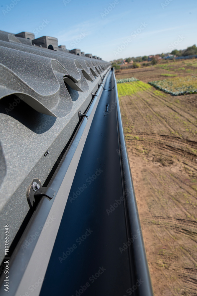 Fototapeta premium Gutter of the drainage system on the house, view from the top