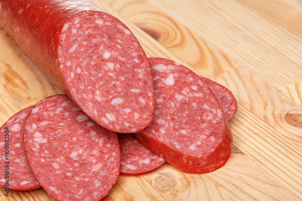 Sausage stick on wooden background. Pork beef sausage.