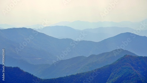 Sunlit mountain ridges around Cheonhwangsan Mountain in Miryang, Korea photo