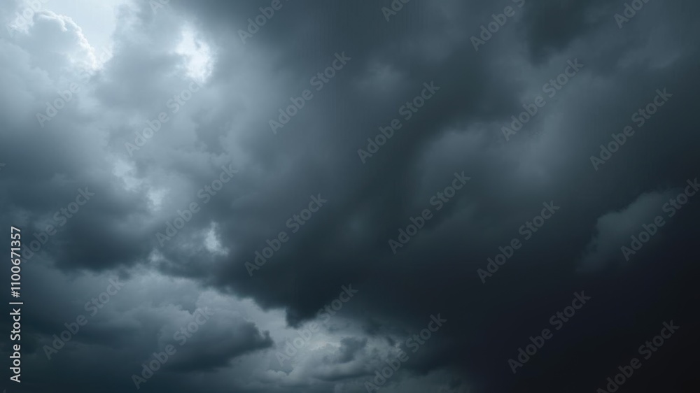 Fototapeta premium Dark storm clouds filling the sky before a downpour, huge, black