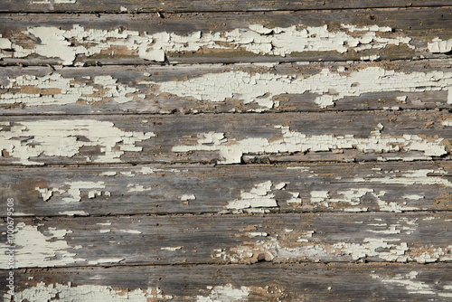 A close up shot of weathered white wooden planks, showcasing the intricate textures, cracks, and faded beauty that tell the story of time and wear. photo