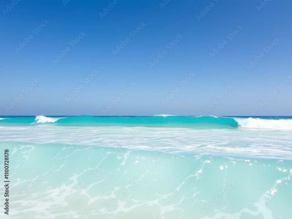 Fototapeta premium Beautiful turquoise waves crashing onto a sandy beach under a clear blue sky, tide, waves