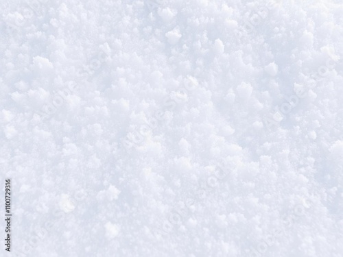 A close-up shot of fresh, fluffy snow covering a page, creating a serene winter scene, icy, snow