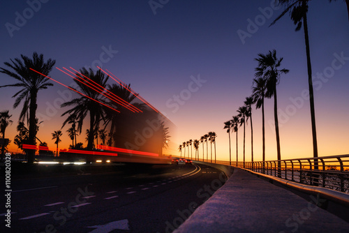 Long exposure of traffic driving over the Ringling Causeway in Sarasota, Florida, during sunset