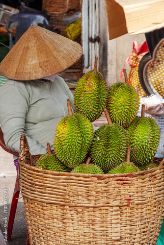 Sleeping durian vendor, Cholon Market, Ho Chi Minh City, Vietnam photo