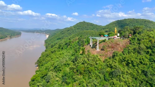 Loei-thailand-22 Nov 2024:Unacquainted tourist walking on Chiangkhan Glass skywalk at Phu khok ngio big buddha chiang khan district loei thailand.New landmark of chiangkhan district