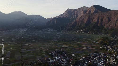 Scenic Aerial View of Mountain Valley with Village and Fields.