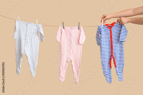 Baby clothes drying on a cl...