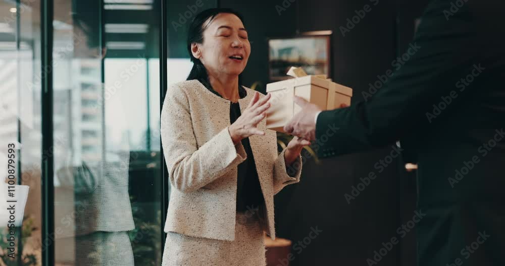 Gift, phone and surprise with Japanese business people in office for birthday, event or respect. Box, present and thank you with employee giving package to colleague for congratulations or milestone