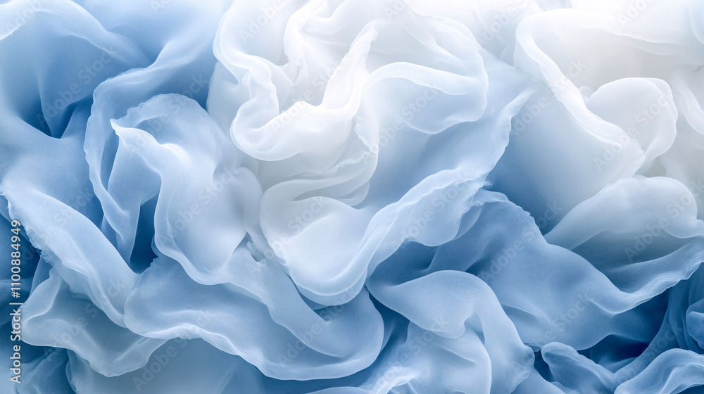 Obraz premium A delicate swirl of soft blue and white fabric, creating an elegant, textured appearance reminiscent of gentle waves or floral petals.