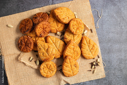 Thekua is a traditional sweet, crispy wheat-flour cookie made with jaggery, cardamom, and ghee, offered during Chhath Puja rituals. photo